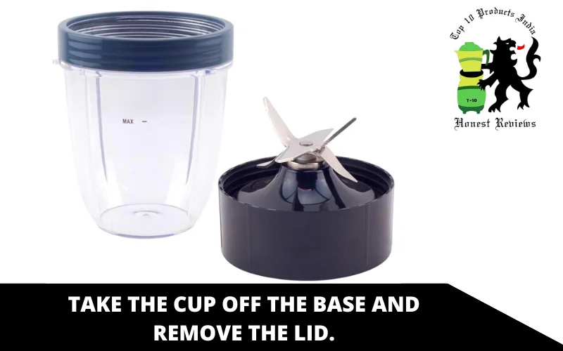 Take the cup off the base and remove the lid